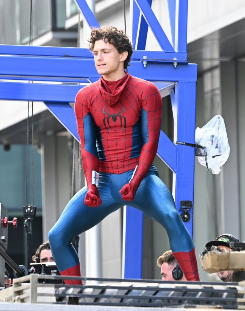 Tom Holland giving a funny face dressed as Spider-Man.