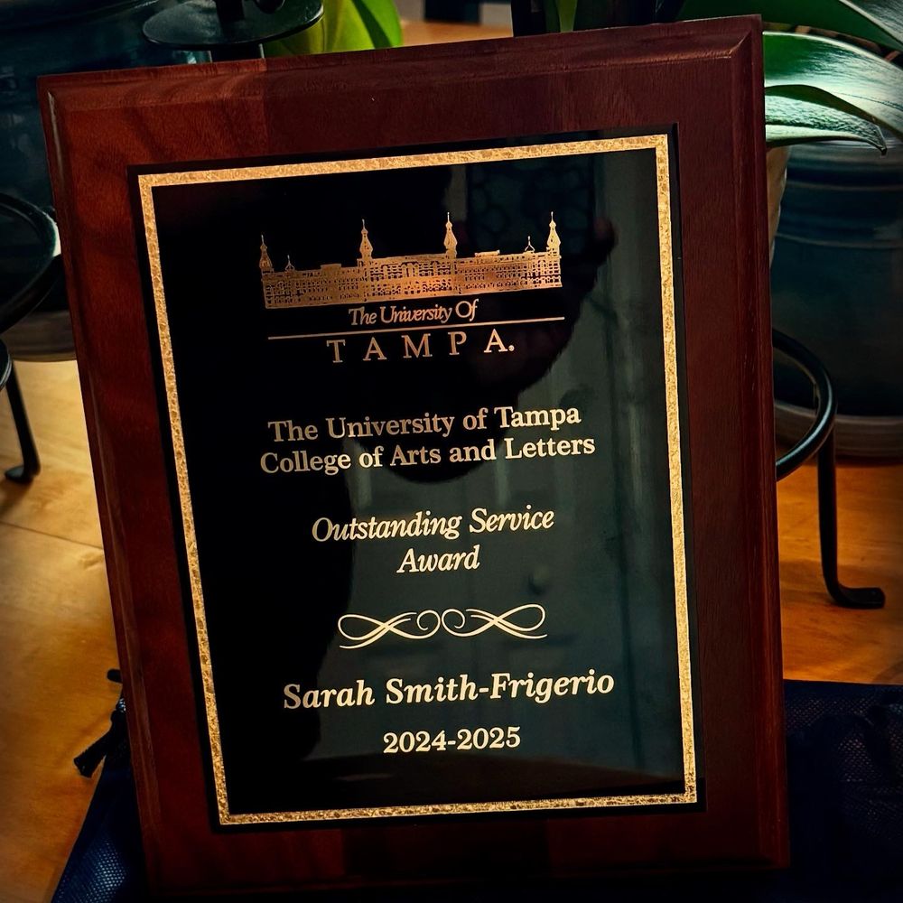 Image of the outstanding faculty service award plaque, college of arts letters at the University of Tampa 2024-2025. 