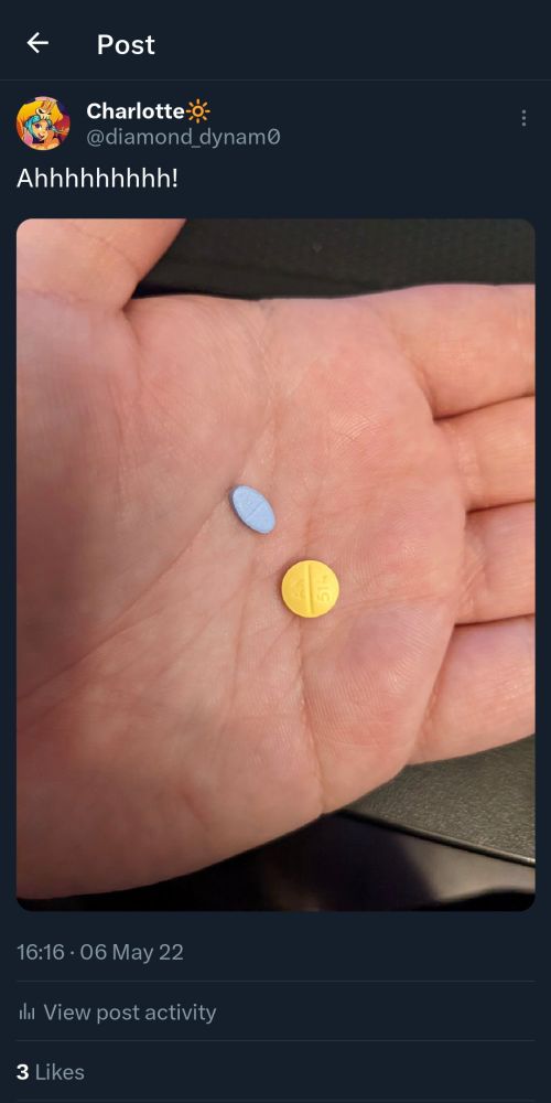 screenshot from a tweet from May 6 2022, with the text "Ahhhhhhhhhh!" and a picture of an estradiol pill and a spironolactone pill in my palm