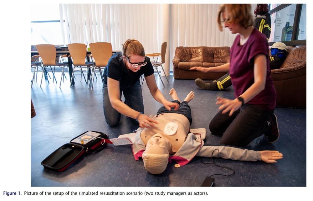 2 Persons perform CPR on a mankind. The left person place the electrodes on the chest of the mankind.
