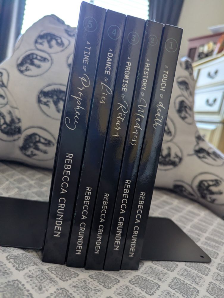 the outlands pentalogy physical books facing spine forward