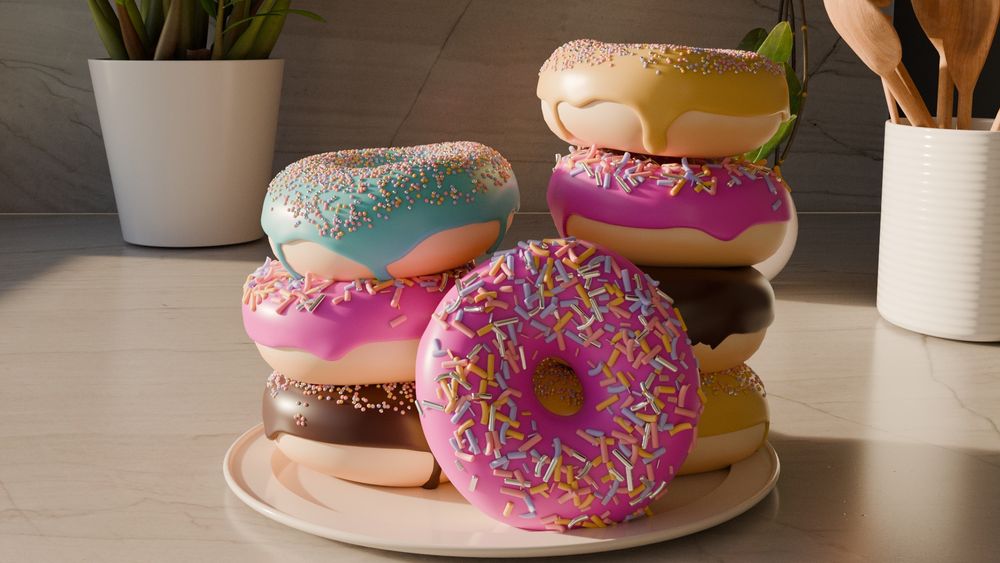 A plate of colorful donuts stacked on a kitchen counter, covered in vibrant icing and sprinkles. The donuts have pastel pink, blue, yellow, and chocolate glazes, with some dripping slightly over the edges. The background features a white potted plant, a ceramic utensil holder with wooden spoons, and a neutral-toned marble backsplash.