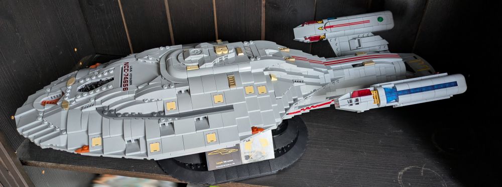a model of the USS Voyager from the Star Trek franchise made from Lego like bricks