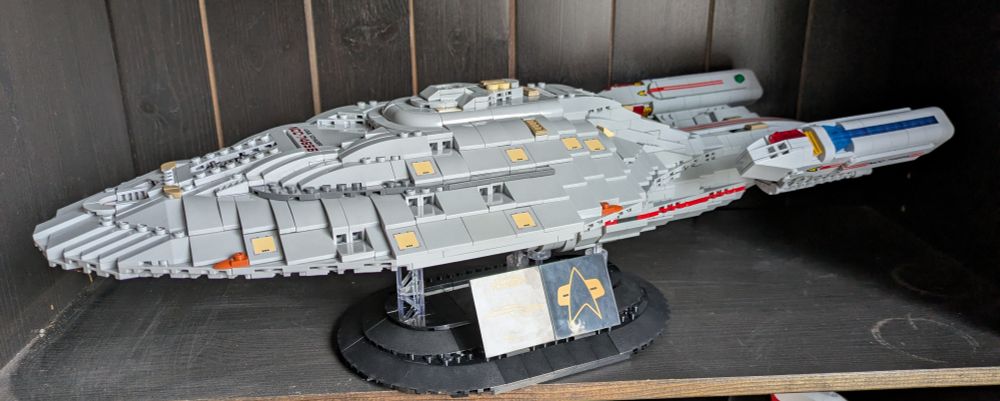 a model of the USS Voyager from the Star Trek franchise made from Lego like bricks