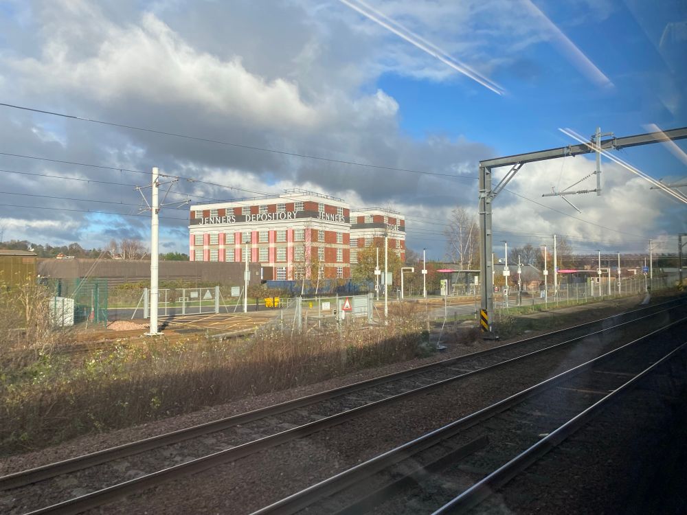 JENNERS DEPOSITORY building near Edinburgh Haymarket railway station, picture taken from a train window.  