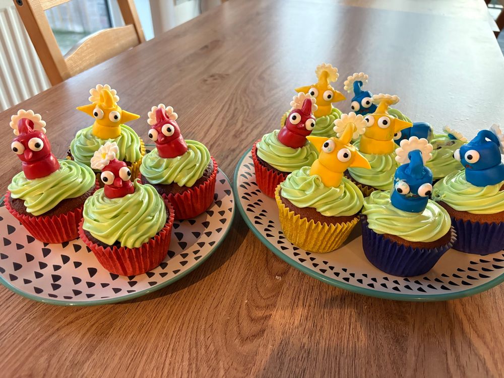 full view of my finished pikmin cupcakes. don't mind that one blue pikmin in the back, lil man is lost in the sauce 