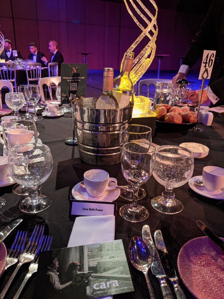 A dinner table in a big hall.
