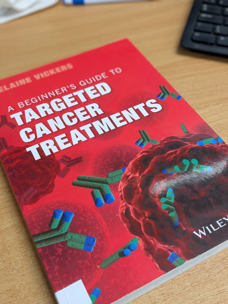 'A Beginner's Guide To Targeted Cancer Treatments' by Elaine Vickers complete with bright red cover. It needs a new shelf mark label...