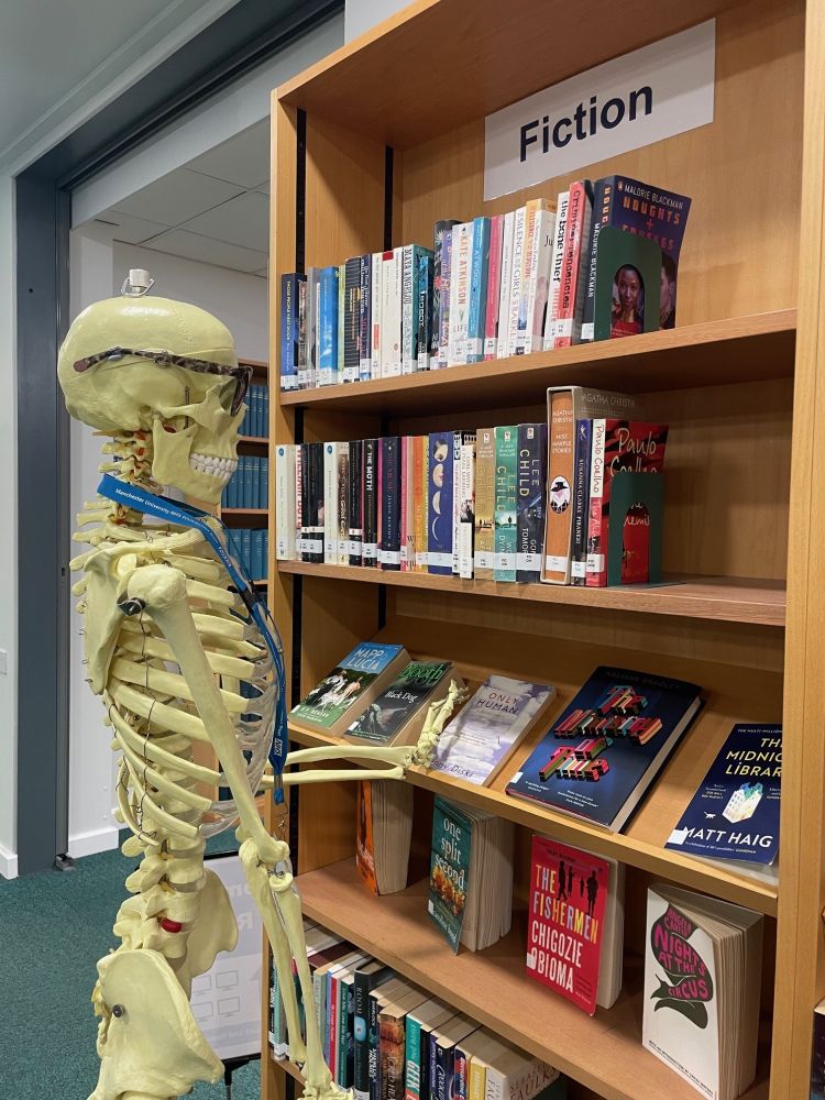 Scully the Skeleton looking at the fiction section!