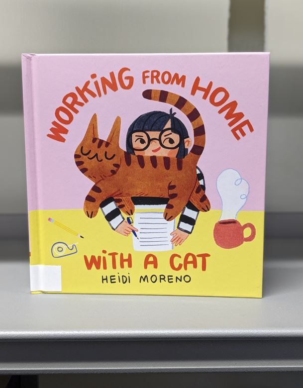 A copy of 'Working From Home With A Cat' by Heidi Moreno on our shelves!