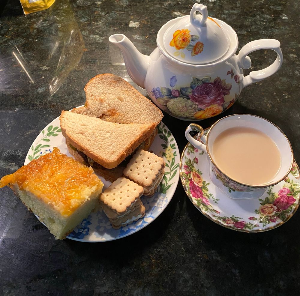 From left to right Lunch Food: Pineapple Upside Down Cake, Chicken Sandwich with Colby Jack and jalapeños, & Lemon Crackers.
Tea is Oolong with Ginger, Cloves and milk