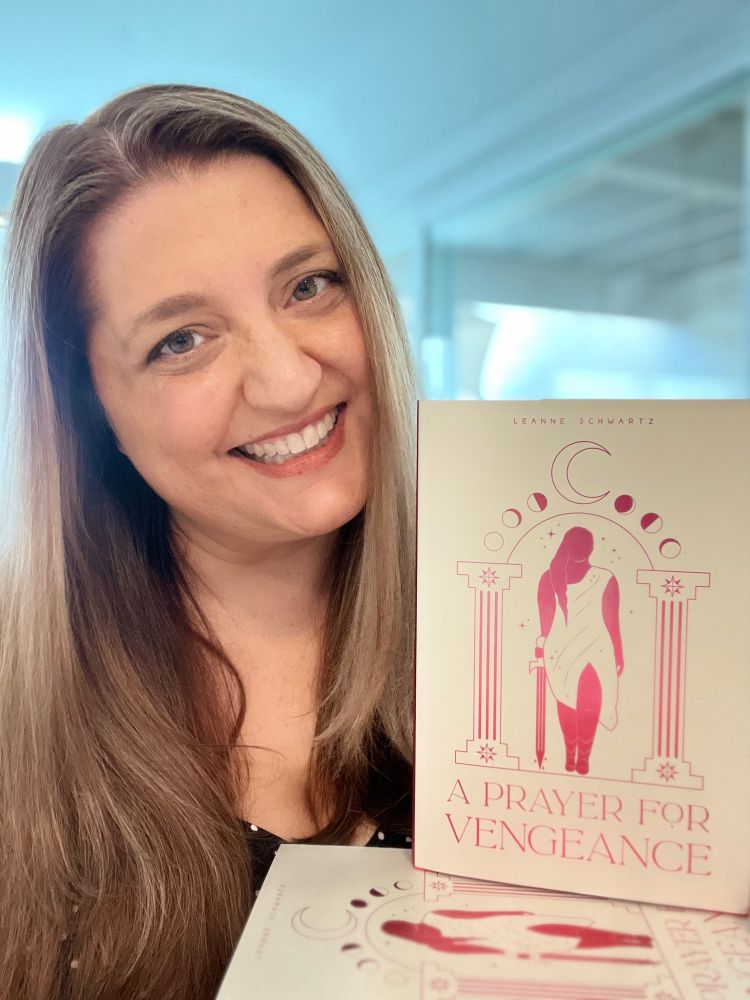 Me smiling with my book A PRAYER FOR VENGEANCE