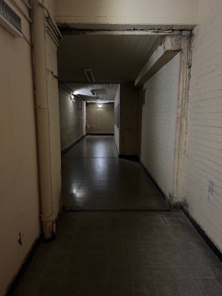 A final much darker corridor with more doors