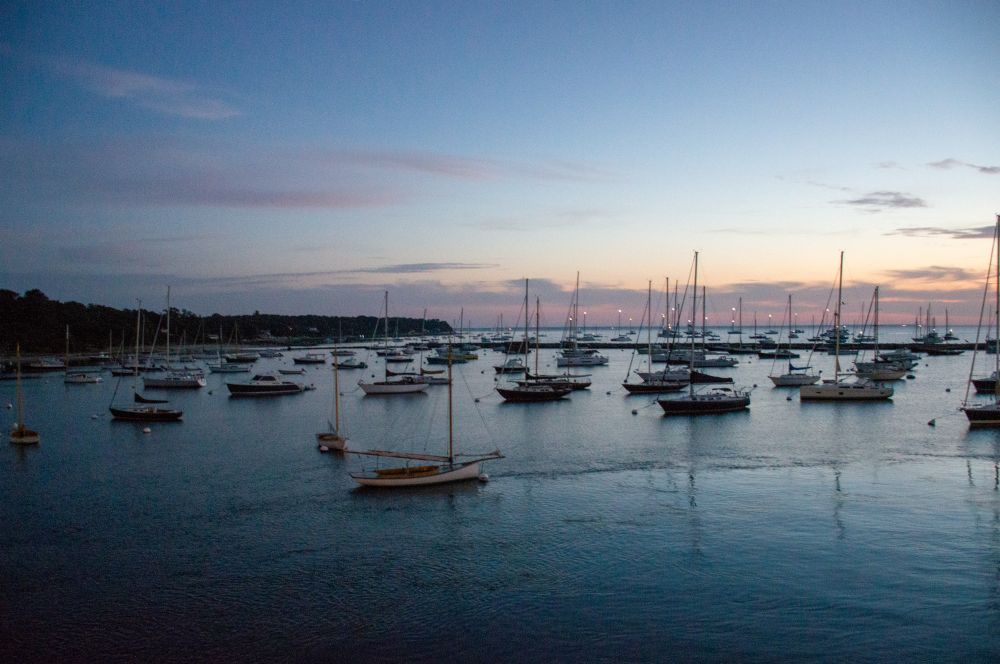 A view of boats in the harbor at dawn