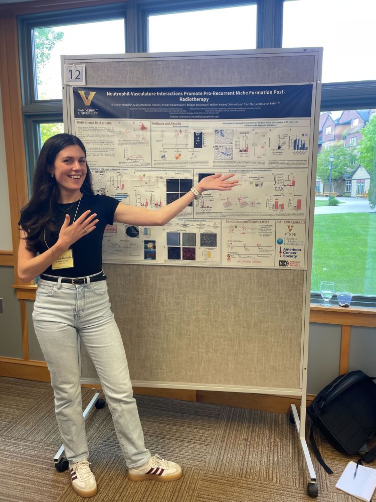 Grad student Shannon Martello excitedly presenting her poster
