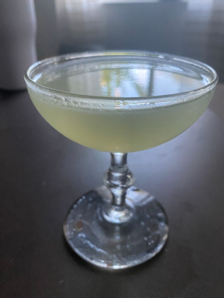 A Green Ghost cocktail in a coupe glass (sacrilege), it’s from the 30s, it’s mostly gin. 

2 oz botanical Gin
½ oz Green Chartreuse
½ oz fresh lime juice

