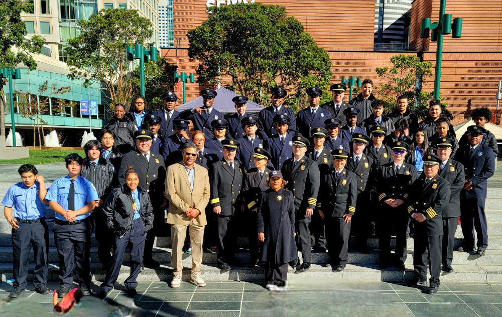 SF Firefighters and cadets standing to pose for a group photo