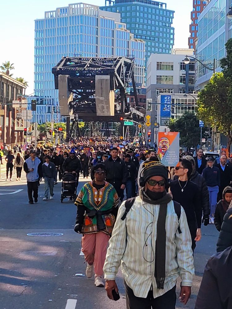 A view of 100s of marchers on the route as they come off the 4th St Bridge