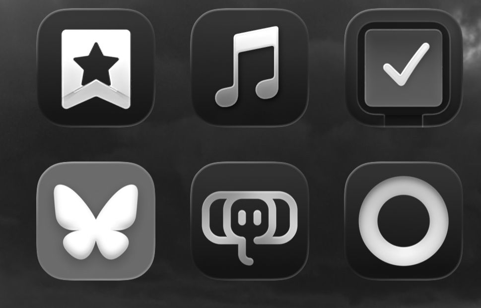 Varios iconos de apps con fondo negro excepto Bluesky, gris. 
