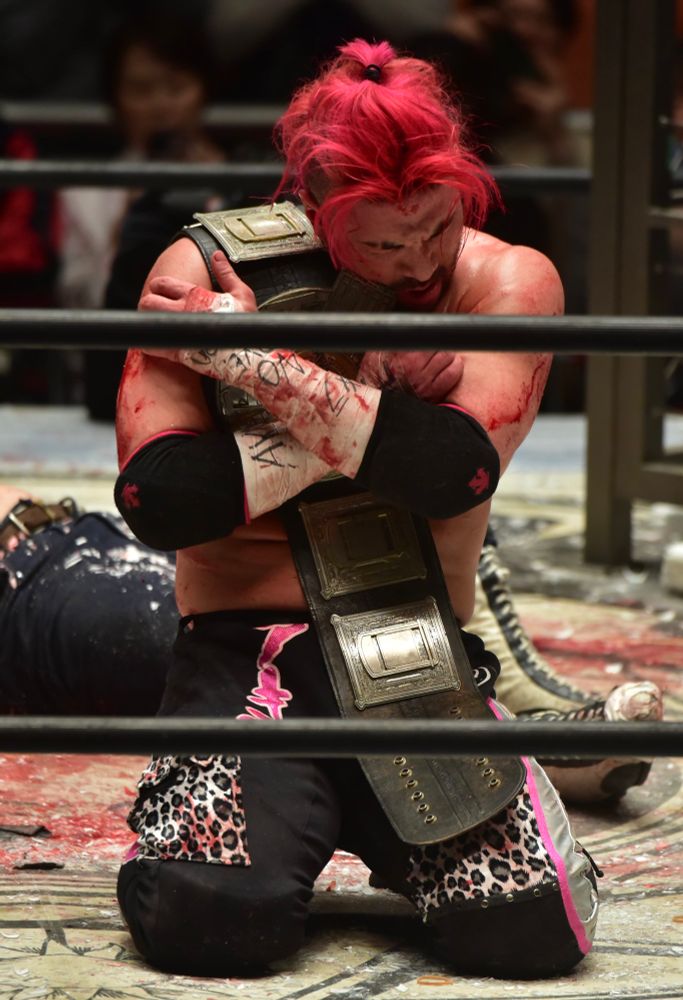 AKIRA with the Big Japan Wrestling Deathmatch Championship.

Photo by Kemurist on Twitter.