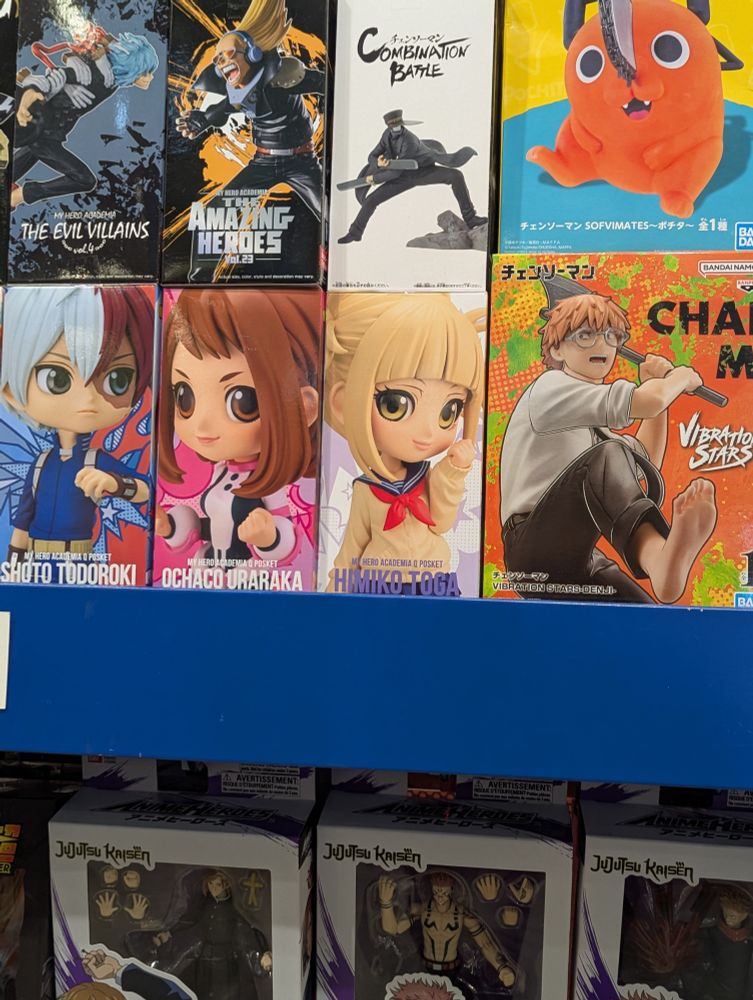 A figure of Himiko Toga from the anime My Hero Academia. She has uncharacteristically innocent and shiny-eyed face and is holding her hand near her face cutely.