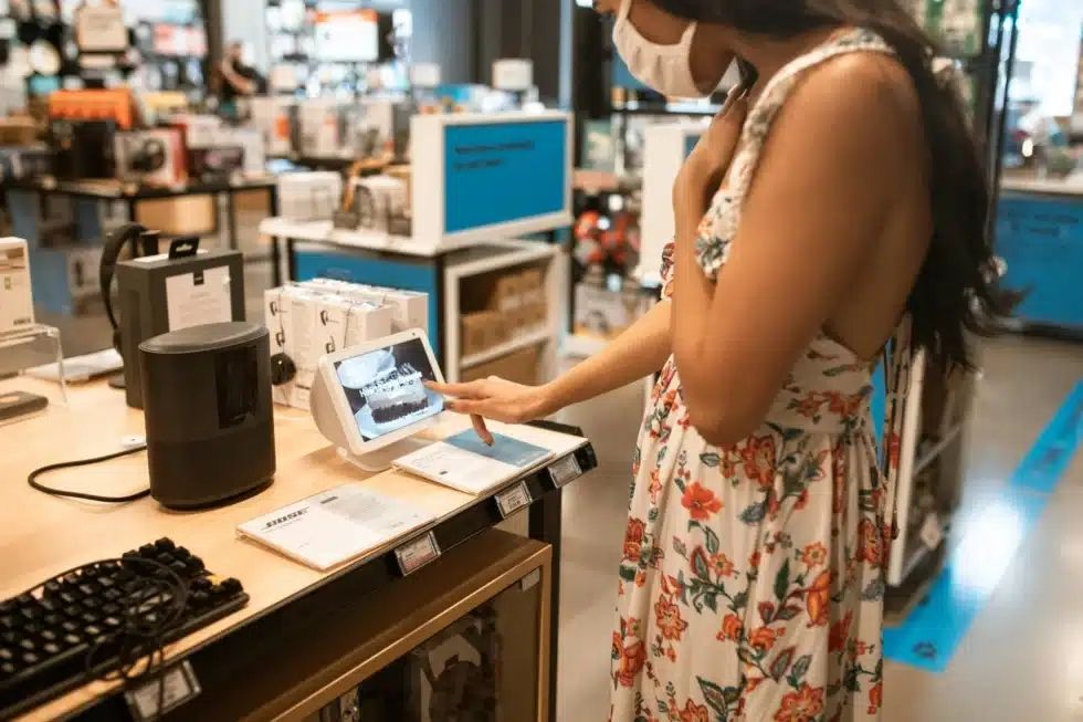 Woman standing at a touchscreen