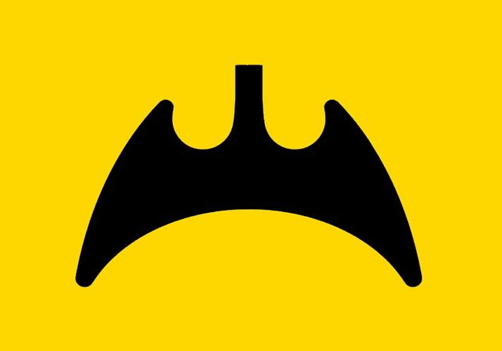 a yellow background with a black bat like shape at the center