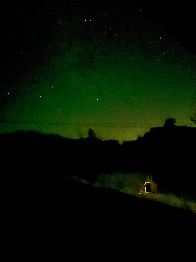 Faint aurora. Old chicken coop in the foreground.
