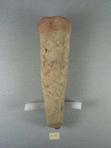 Pottery funerary cone. The cone is inscribed for a man Ny-ta. For a translation of the inscription see 37.1845E. The clay is brick red on the surface. 

Condition: Tip broken; buff slip (?) only partially preserved; white incrustation on pointed end.