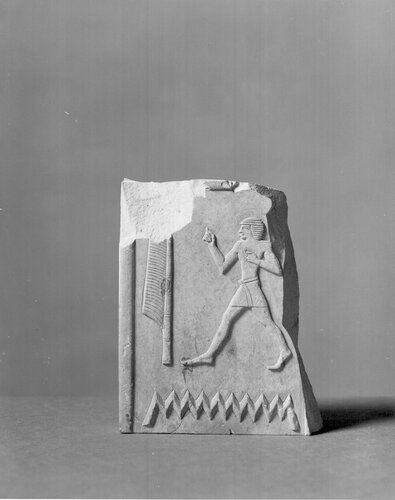 Fragment of limestone relief retaining portion of single column of inscription. Only three hieroglyphs preserved, of outstanding quality.

Condition: Edges chipped.