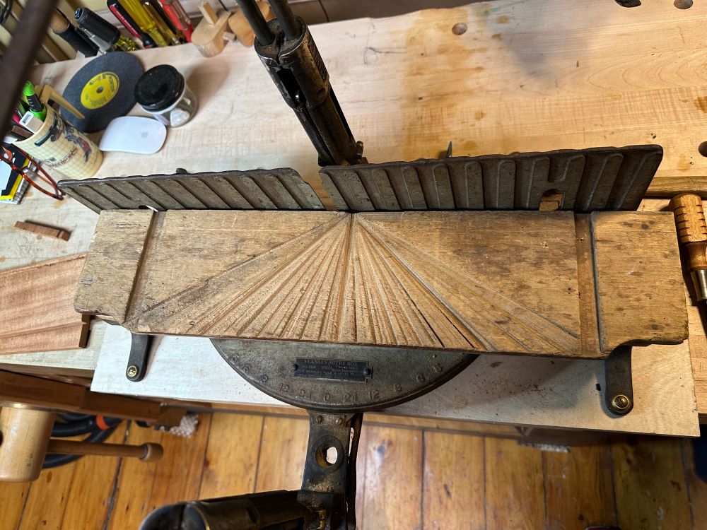 The tired old surface of the mitre box  