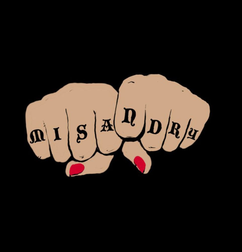 A drawing of knuckles with letters that say “MISANDRY”. There is nail polish visible on the thumbs. 