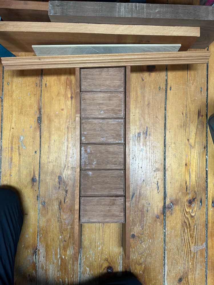 The drawer boxes laid out in a six tall arrangement 