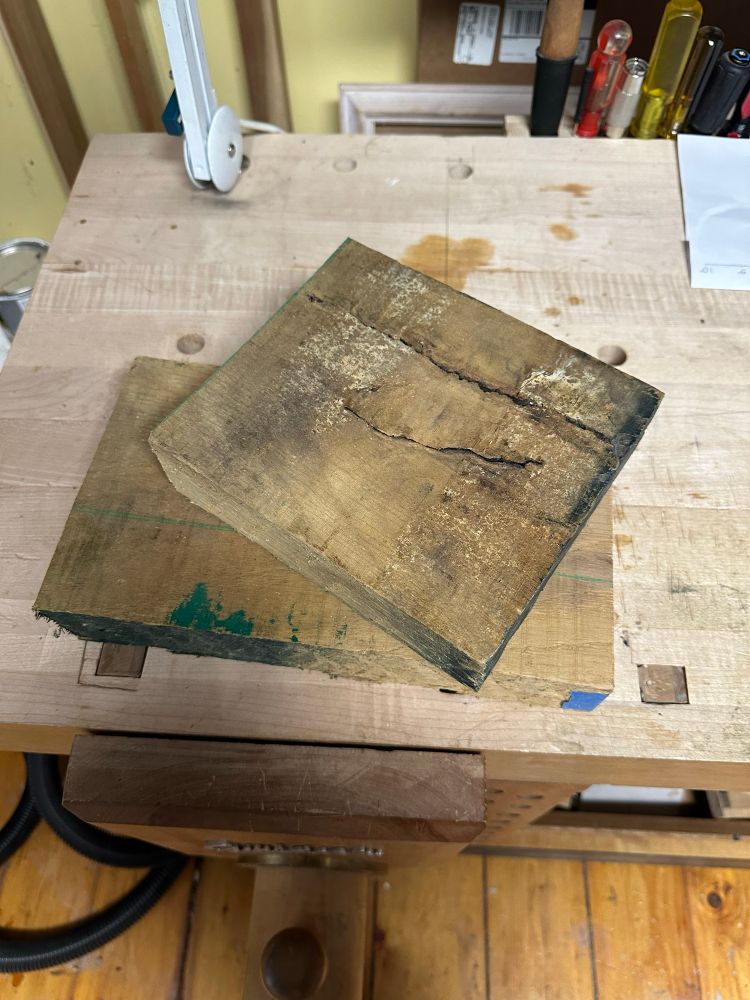 An offcut of thick white oak with the checked and warped part cut off. 