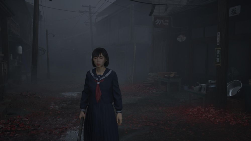 Screenshot from Silent Hill f. A young Asian girl holding a steel pipe and wearing a school uniform stands on a foggy street with red fungus growing out of the ground. 