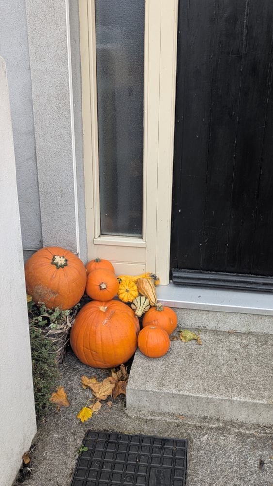 Pumpkins in a doorway.