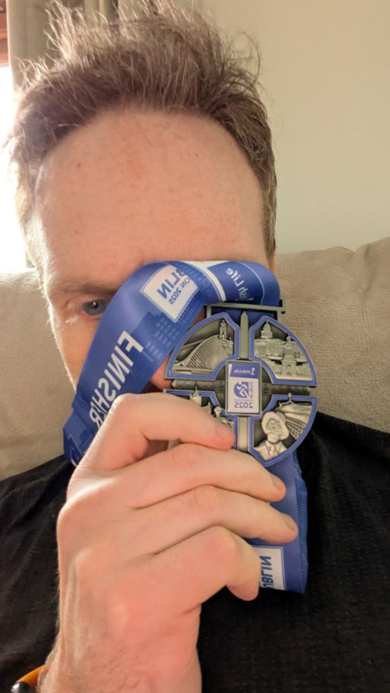 Listen it was four hours in the rain so we can chill on any assessment of the hair.

Selfie of generic white man with GREAT HAIR holding a medal in front of his face for completing the Dublin City Marathon. 