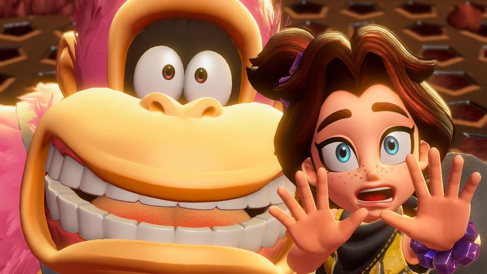 La grosse face de Donkey Kong, avec des poils roses. Un personnage féminin brun aux yeux bleus est devant lui et semble le protéger. 