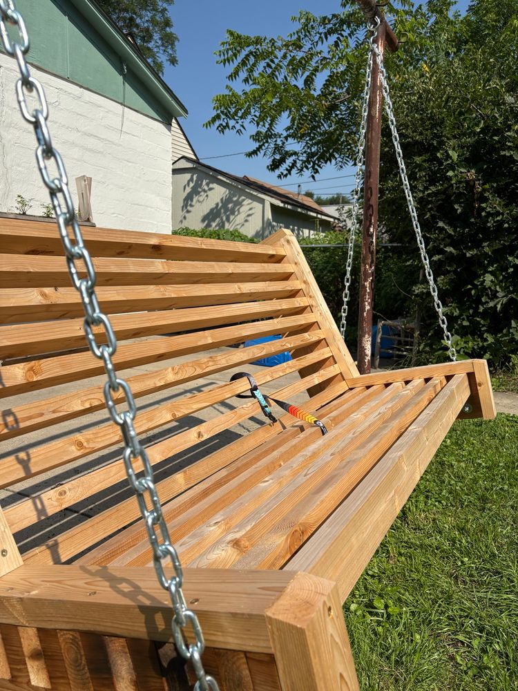 Side view of swinging bench made from cedar 