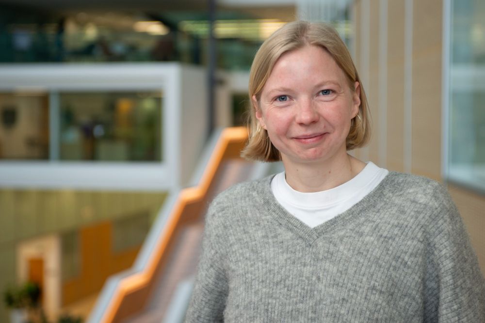 Lara Krüger, stood in the LMB atrium, smiling.