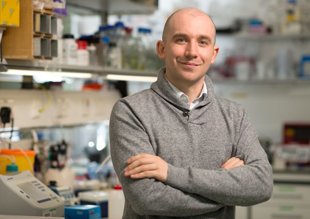 Portrait photo of Emmanuel Derivery stood in a lab space