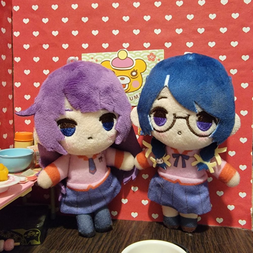 Small Monogatari Series plushies of Senjougahara Hitagi and Hanekawa Tsubasa in a miniature room with hearts for wallpaper