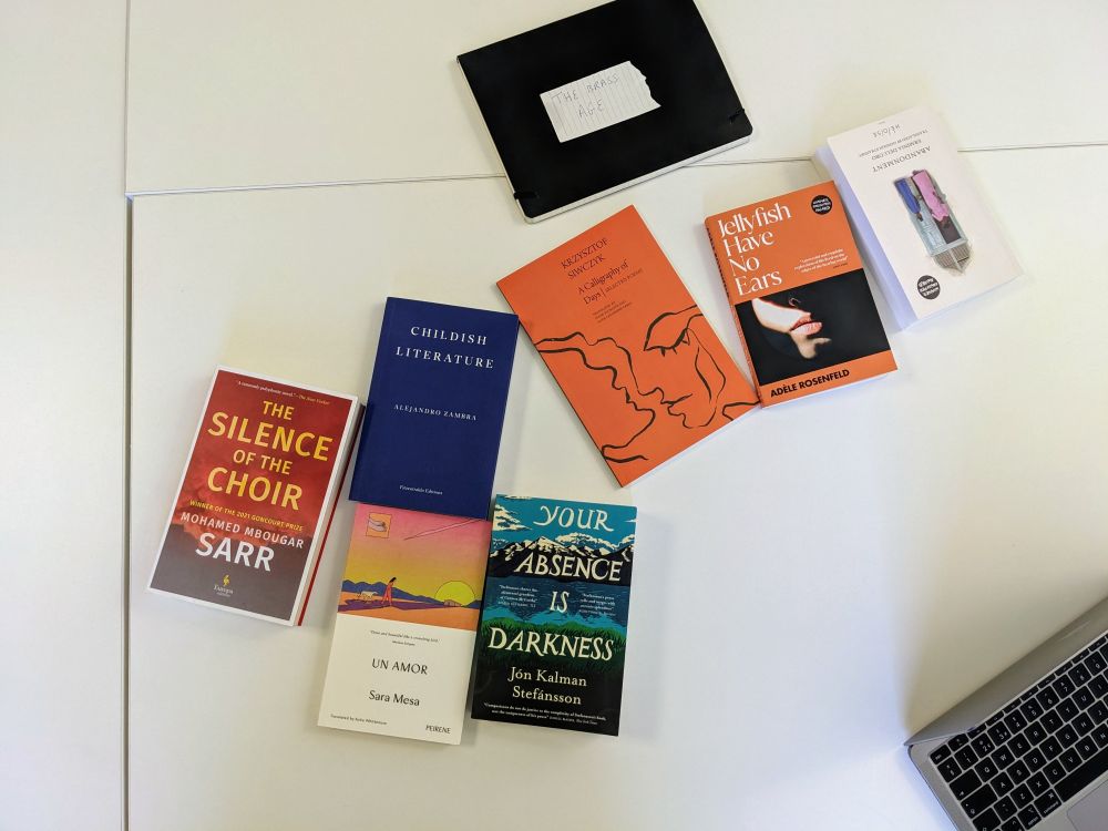 All the 8 shortlisted titles spread out on a table