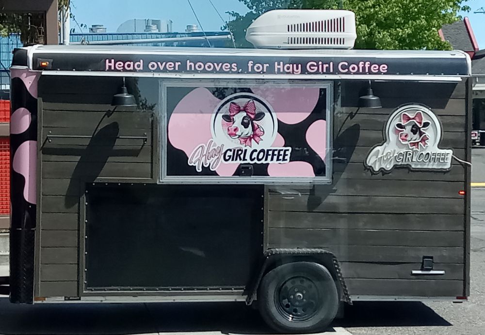 Food trailer reading "Head over hooves, for Hay Girl Coffee.