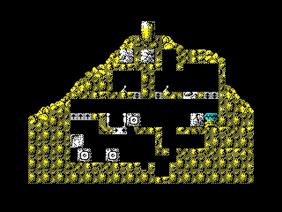 Quadrax on the ZX Spectrum. A side on view of the inside of a tomb carved into a mountain top. The shot is taken just as our 2 heroes have united and are about to pop into the teleport to end the level. It took me ages to get here, it's a tricky level. 