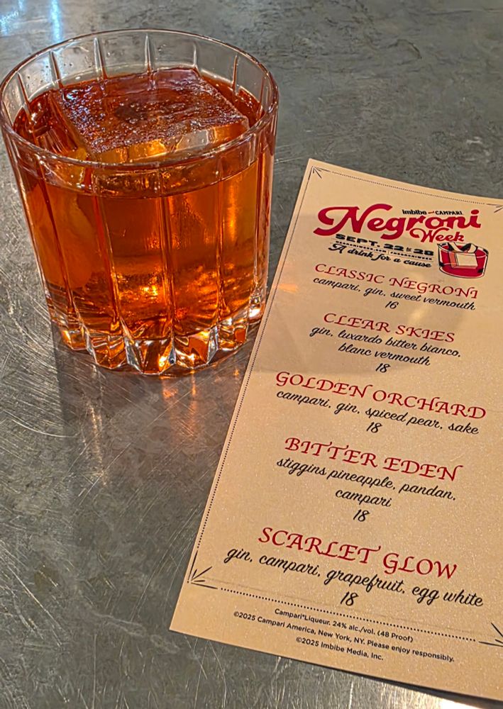 A golden orchard negroni with a negroni menu