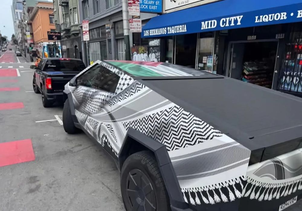 Tesla Cybertruck wrapped with Kuffiyah and the flag of Palestine on the top in support of Palestinians. (San Francisco in front of Los Hermanos Taqueria)