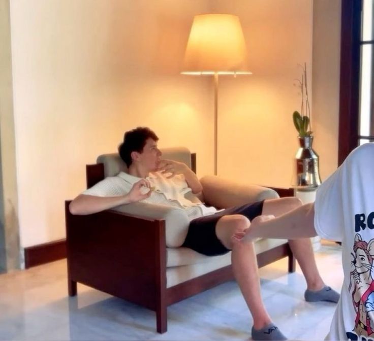 daniel howell sitting on a chair