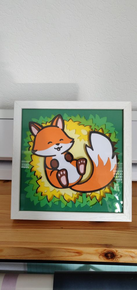 fox shadowbox showing a happy fox on a leafy background