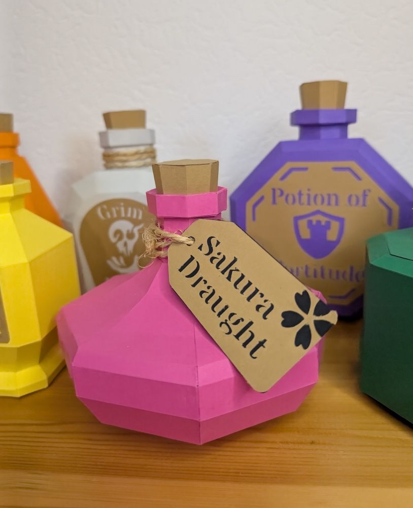 Collection of paper craft bottles. 